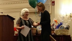 Denise McGoldric presents the 2015 NECHA grant to Emily Rosenthal at the Combined Annual Meeting. 